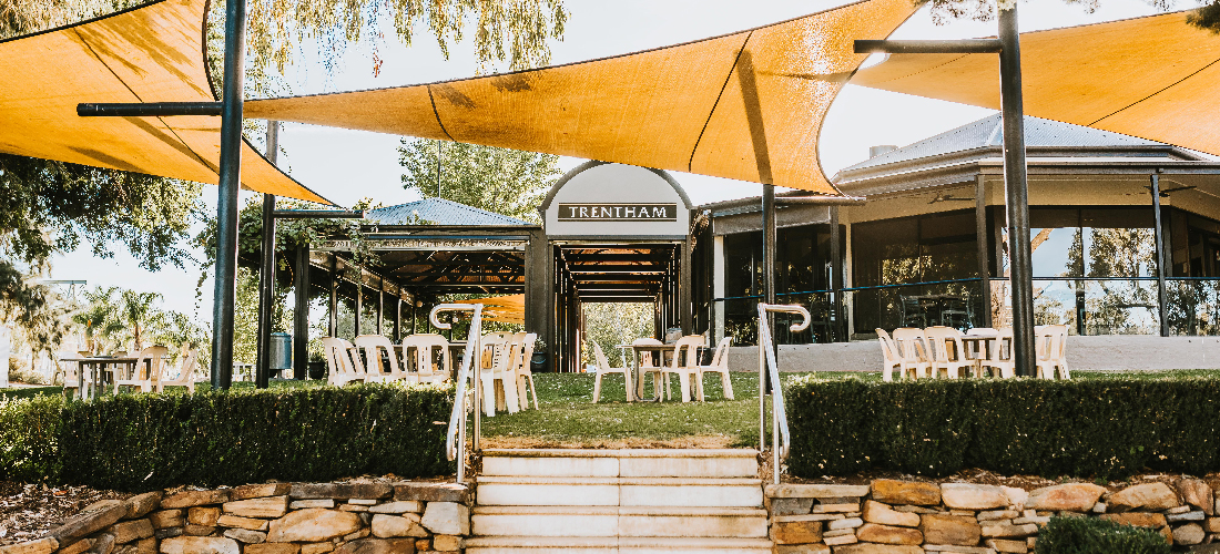 View of outdoor dining under shade sails